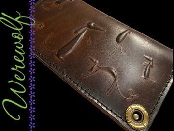 Brązowy skórzany portfel z psami