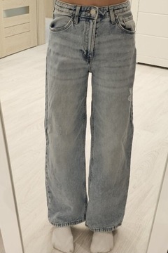 Spodnie regulowane w pasie jeansy