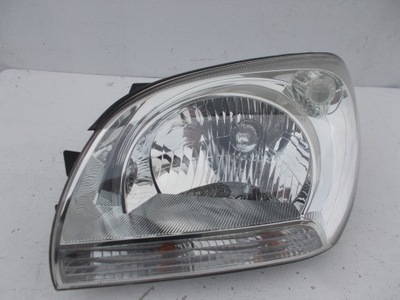 Фара лампа kia sportage ii 2 europa левая фото №1