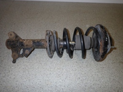 Primera p12 02-07 амортизационная стойка амортизатор левый перед фото №1