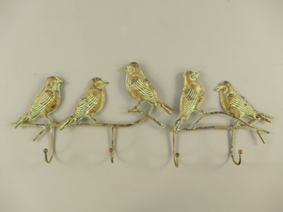 Metalowy wieszak z motywem ptaków patyna