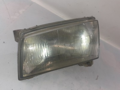 Mazda demio фара лівий фото №1