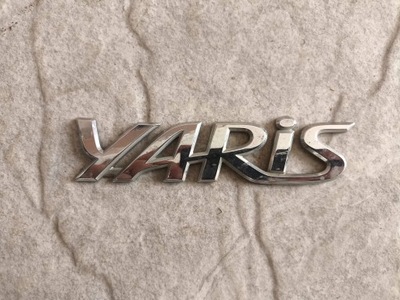 Emblemat Napis Klapy Tył Toyota Yaris II 06-11 75442-0D050