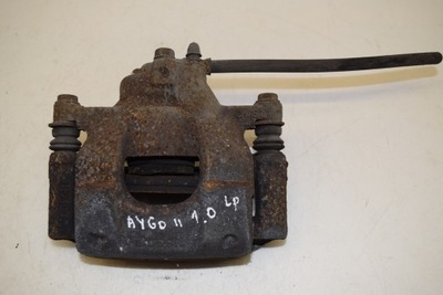 Toyota aygo ii 1.0 суппорт тормозной левый перед фото №1