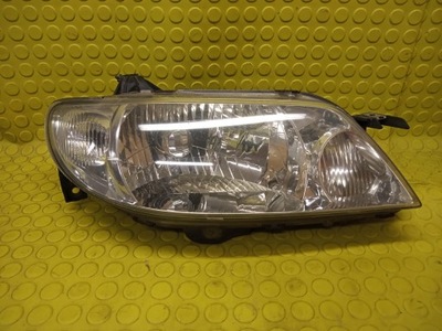 Mazda 323 лампа фара правий перед фото №1