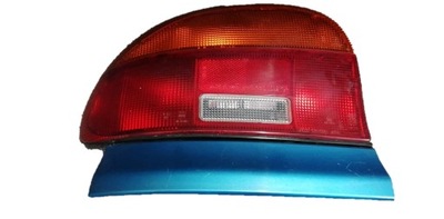 Mazda 121 молдинг лампа ліва задня canarian blue фото №1