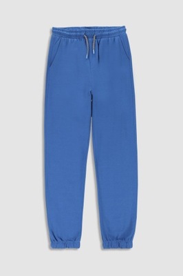 Chłopięce spodnie dresowe niebieskie 134 Mokida