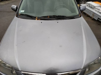 Капот bl5p mazda 323 bj рестайлінг фото №1
