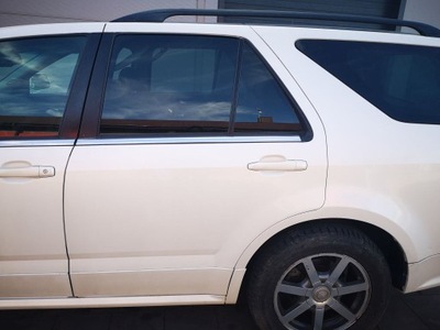 DE PUERTA IZQUIERDO PARTE TRASERA CADILLAC SRX COLOR BLANCO  