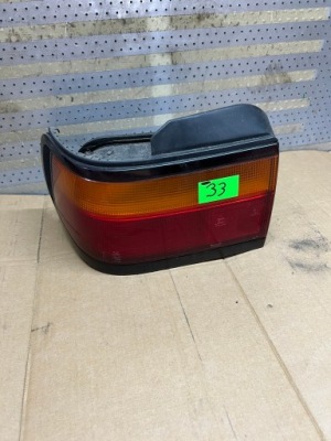 Honda concerto 88-95 5d хетчбек лампа задня ліва оригінал фото №1