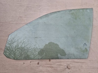 Скло двері лівий перед skoda octavia i 2003r фото №1