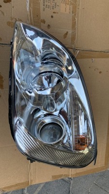 Kia carens 2006- лампа левая передняя перед фото №1