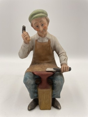 Porcelanowa figurka kowala 14cm