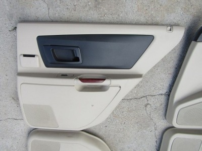 Cadillac srx обшивка оббивка двері задня права фото №1