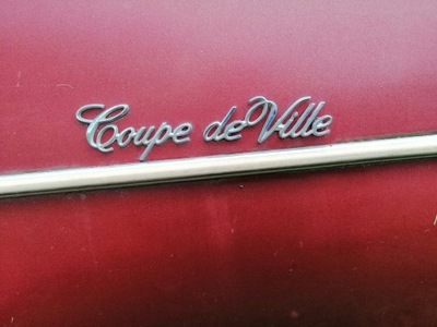 CADILLAC DEVILLE 1974 1976 EMBLEMA DEVILLE CUPÉ  