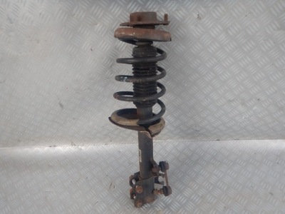 Nissan x-trail t30 2.5b лівий амортизатор перед фото №1