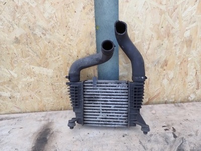 Інтеркулер nissan note 144619u20a фото №1