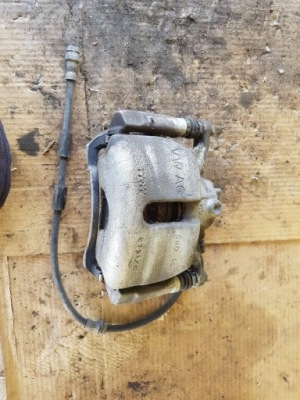 Супорт гальмівний лівий перед vw golf vii 5521c фото №1