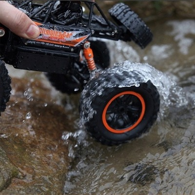 ZDALNIE STEROWANY SAMOCHÓD TERENOWY 4x4 AUTO TERENOWE CRAWLER POMARAŃCZOWY