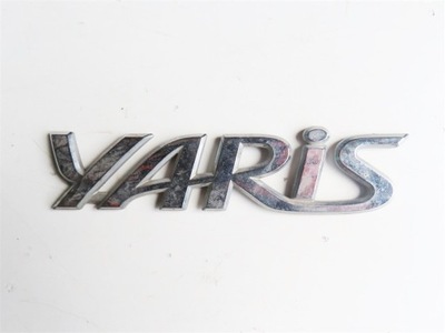 EMBLEMA TRASERA DE TAPA TOYOTA YARIS II 2006-2011 AÑO  