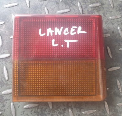 Лампа левый задняя крышка багажника mitsubishi lancer iv hb фото №1