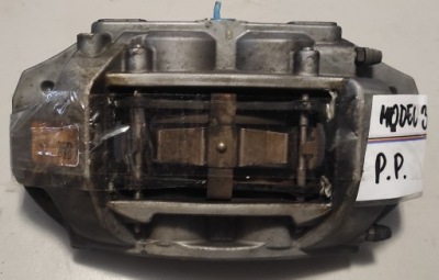 Tesla model 3 y супорт гальмівний гальмівні колодки правий перед фото №1