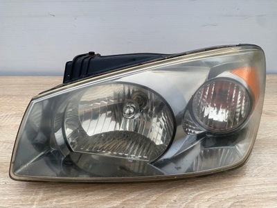 Лампа фара лівий перед kia cerato i + вкладиш - 921012f0 фото №1