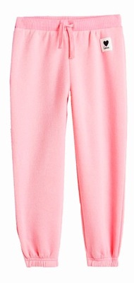 NOWE H&M spodnie dresowe jasne różowe 104