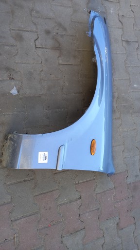 BŁOTNIK LEWY PRZÓD MAZDA 323F 03R