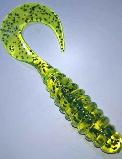 Manns Twister 10cm Przeźr. żółty fluo czarny brok.