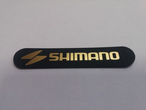 SHIMANO naklejka emblemat 58 x 11 mm * ZŁOTA