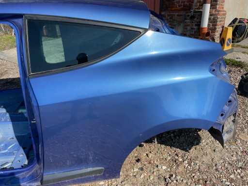 BŁOTNIK TYŁ MEGANE III COUPE