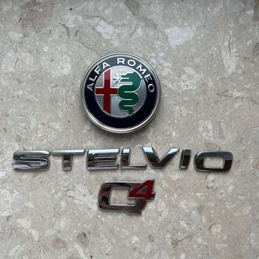 EMBLEMAT del cofano posteriore ALFA ROMEO STELVIO 50534924 Originale