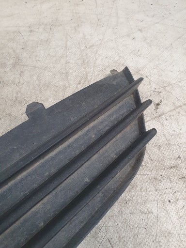 grid of a bumper left front 13117250 375768702 OPEL ASTRA H 04r.