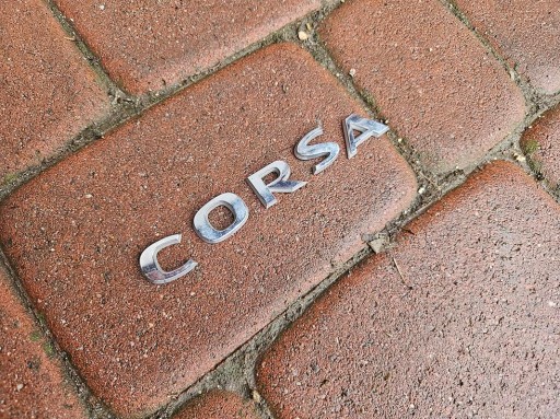 Emblemat logo napis na kapotu Corsa D Opel Corsa E F