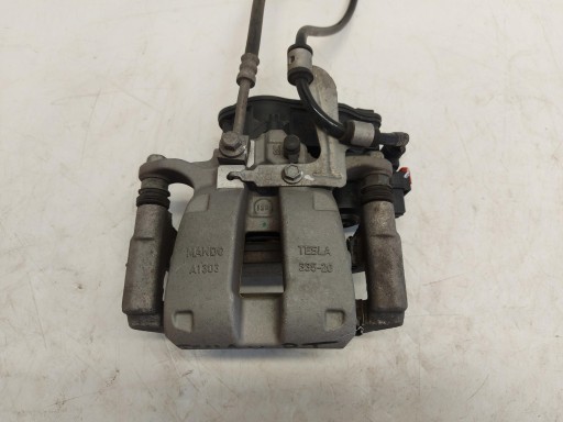 TESLA MODEL Y 2022r caliper jarzmo hamlcowy right rear part rear 1044626-00-b