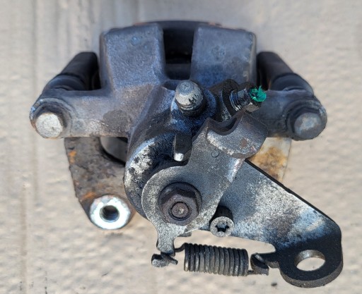 JARZMO caliper brake rear part left rear RENAULT SCENIC II 1.6 16V OE