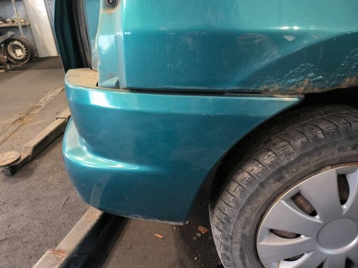 bumper rear part green MAZDA DEMIO and