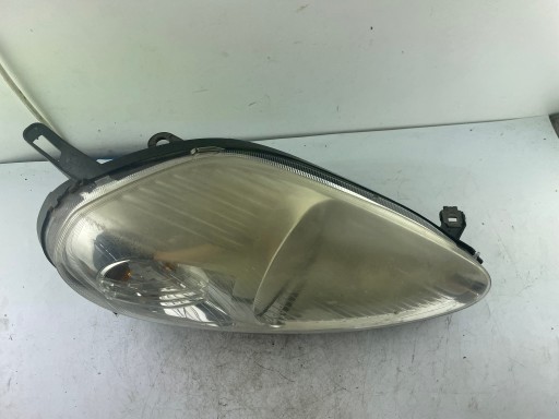 Reflektor right Fiat Grande Punto 0051701594 electrical regulacja