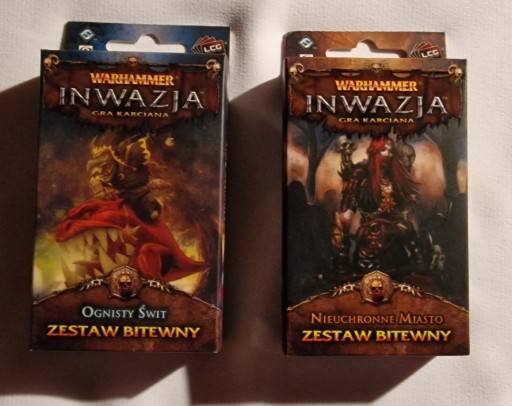 Zdjęcie oferty: Warhammer Inwazja Nieuchronne Miasto + Ognisty Świt, nowe, zaplombowane