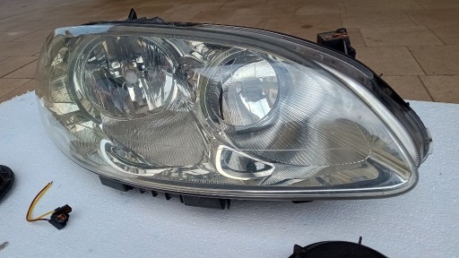 Zdjęcie oferty: Reflektor PP OE Fiat Croma 2007 uszk. mocowania