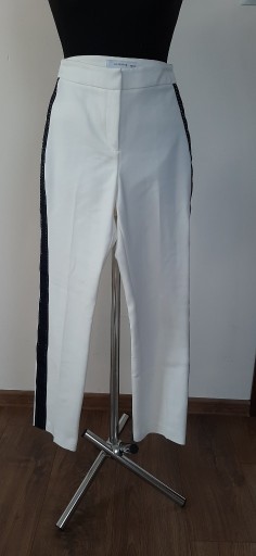 Zdjęcie oferty: Białe spodnie z lampasem Reserved rozmiar 34