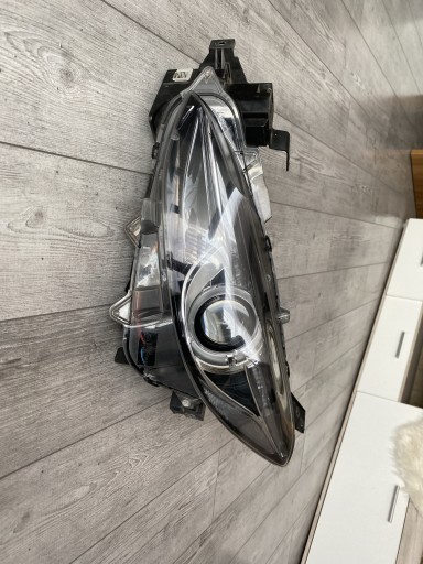 Zdjęcie oferty: Oryginalna lewa lampa reflektor xenon Mazda 3 BM
