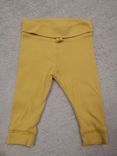 Zdjęcie oferty: Prążkowane legginsy spodnie z falbanką Next 62 68