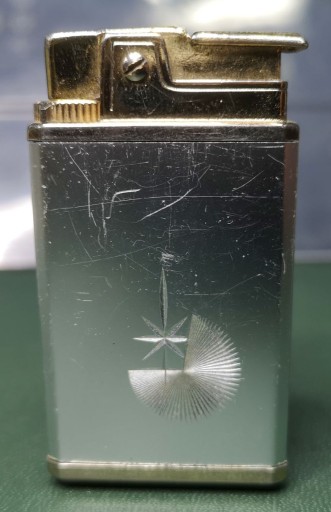 Zdjęcie oferty: Zapalniczka metalowa z pozytywką vintage prl