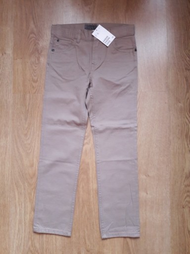 Zdjęcie oferty: H&M NOWE spodnie z diagonalu beżowe r.128