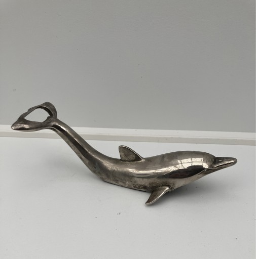 Zdjęcie oferty: otwieracz butelek srebrny delfin kapsle nakrętki 