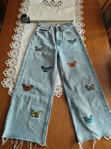 Zdjęcie oferty: Spodnie dziewczęce jeans niebieskie (w motyle)