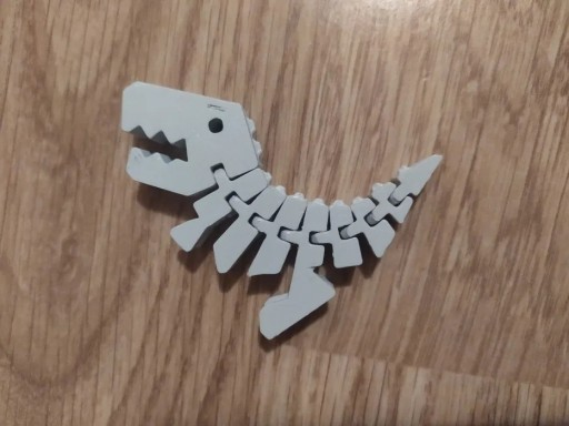 Zdjęcie oferty: Dinozaur giętki breloczek zabawka