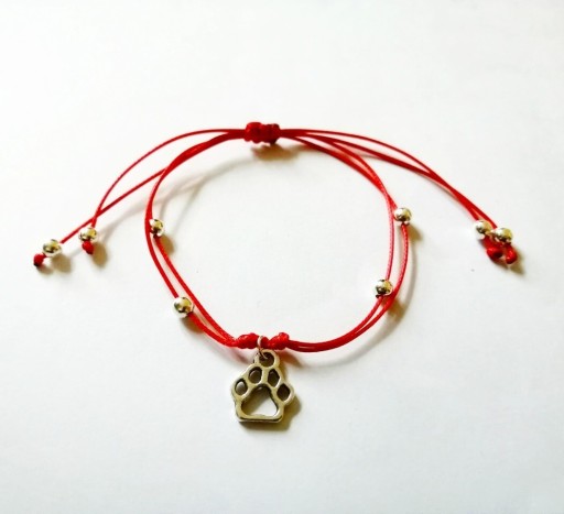 Zdjęcie oferty: Bransoletka czerwona sznurek z łapką psa kota